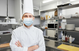 a chef wearing a face mask