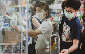 people wearing medical masks in the store