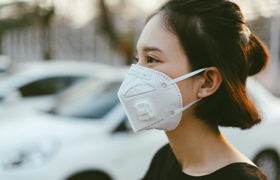 a young Asian female wearing an N95 mask